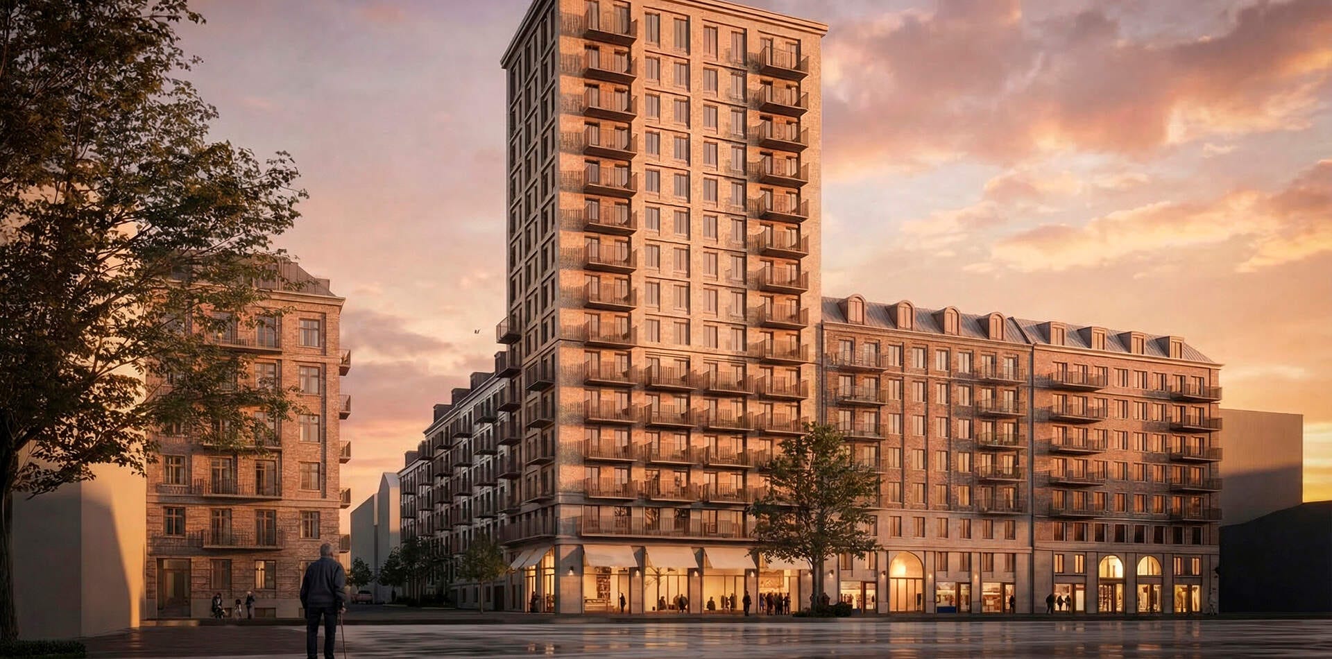 Visualisering - Nyproduktion Göteborg – Exteriörvy av flerbostadshus med balkonger och upplysta butikslokaler i gatuplan vid solnedgång.