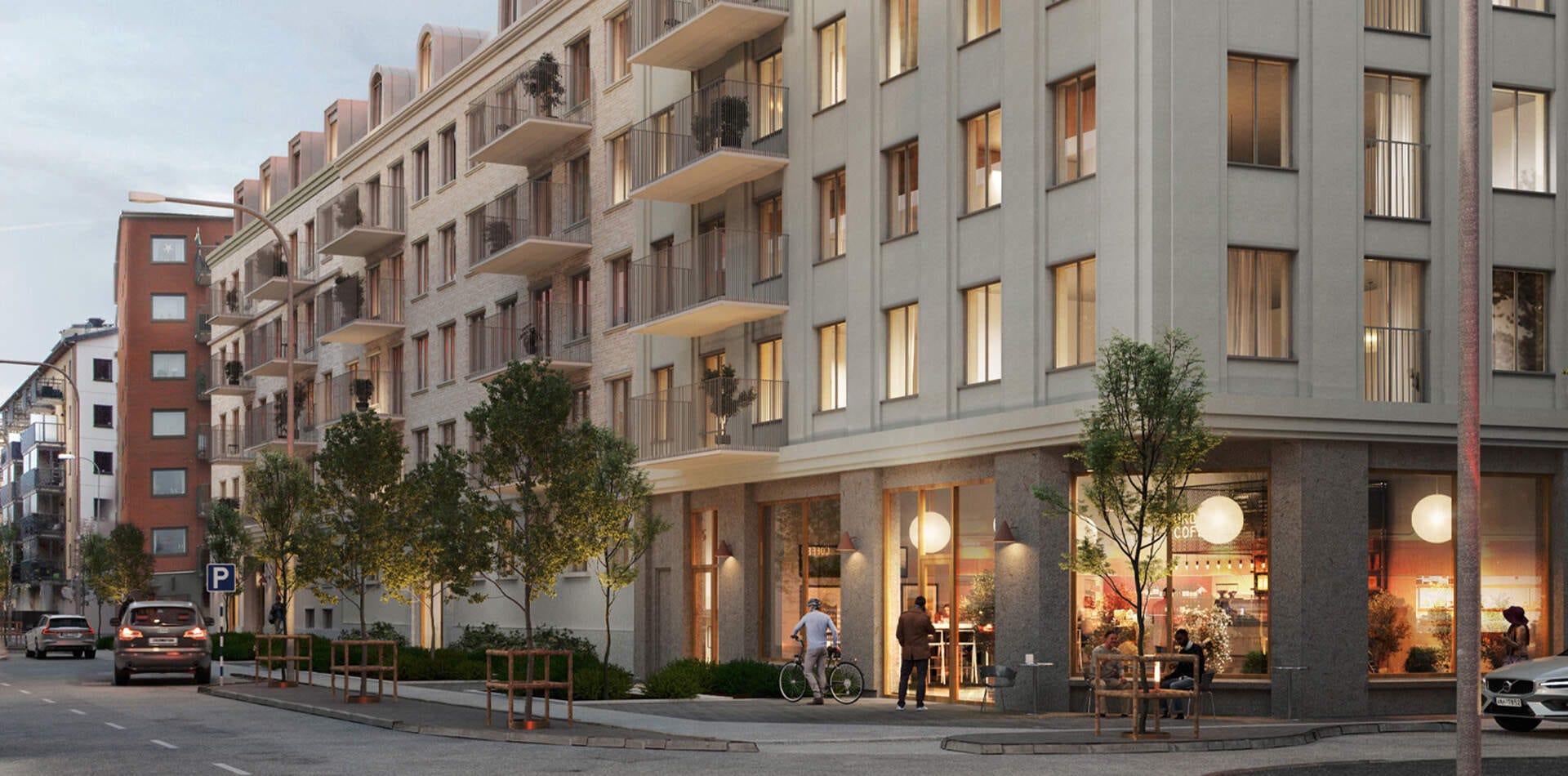 Visualisering - Nyproduktion Göteborg – Exteriör bild av ett bostadshus med balkonger. En cyklist passerar ett kafé på bottenvåningen. Flera träd längs trottoaren.