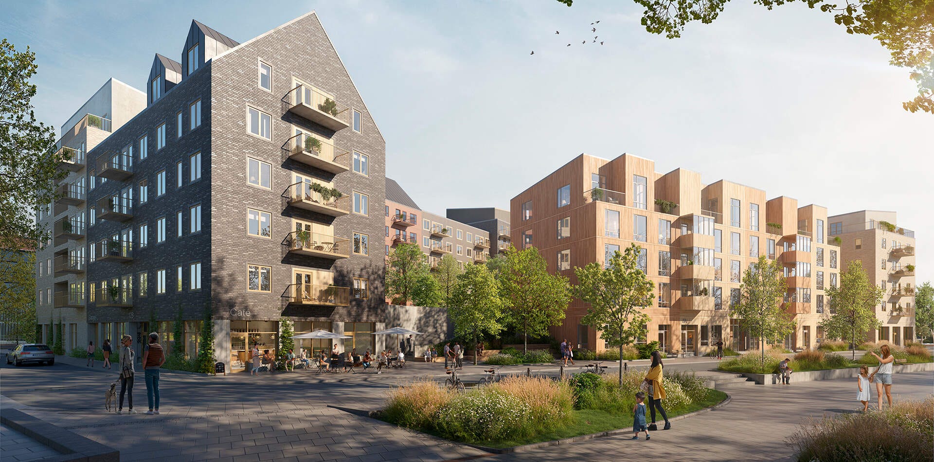 Visualisering - Nyproduktion Nacka – Planias flerfamiljshus. En byggnad i tegel och en i trä med balkonger. Grönska och människor i området.